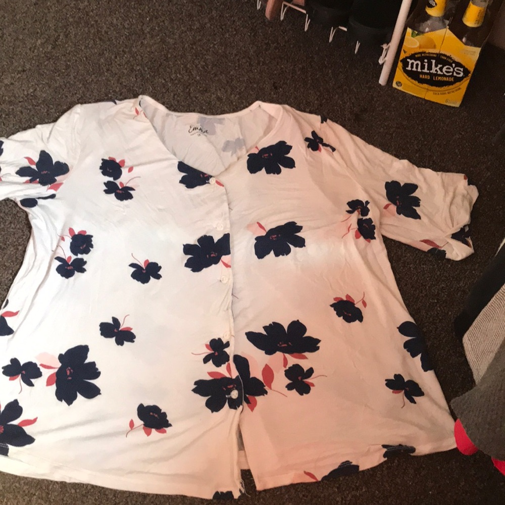 A short sleeve blouse with flowers.